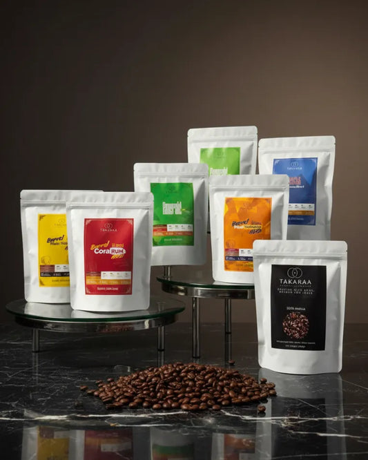 Assorted coffee packages on a dark surface with a brown gradient background