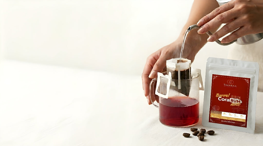 Person pouring tea from a teapot into a cup with a package of Torani syrup on a white background
